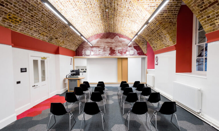 interior view chairs with graphics in the walls and ceiling